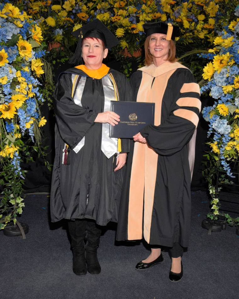 Crystal Brock on stage receiving her hood