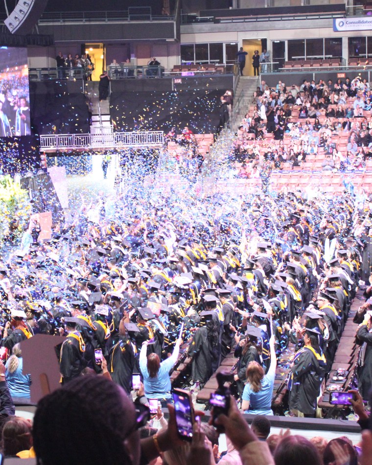 The commencement arena packed with graduates and families